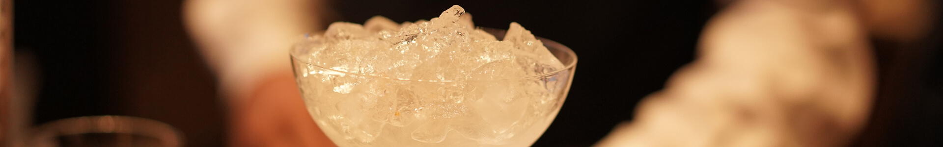 Crushed ice in a cocktail glass.