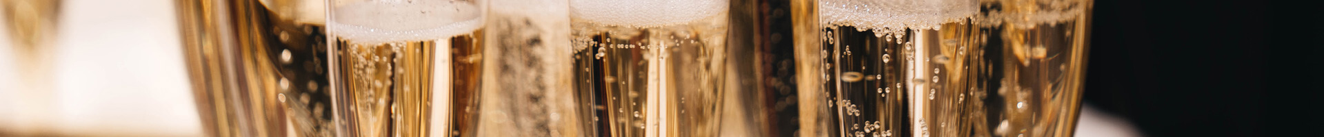 Sparkling wine in champagne glasses.