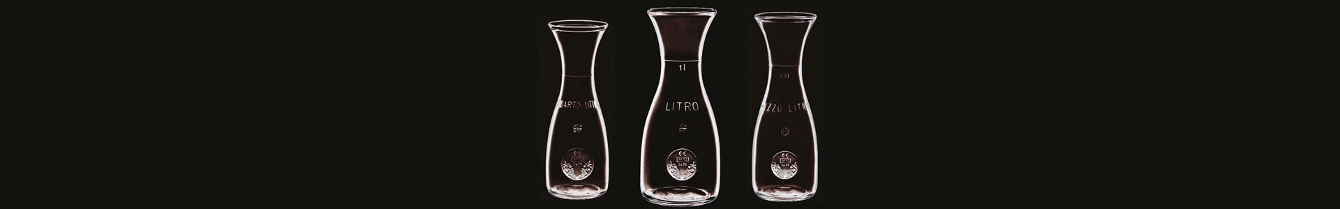 Three carafes from Bormioli Rocco's Misura series in different sizes.