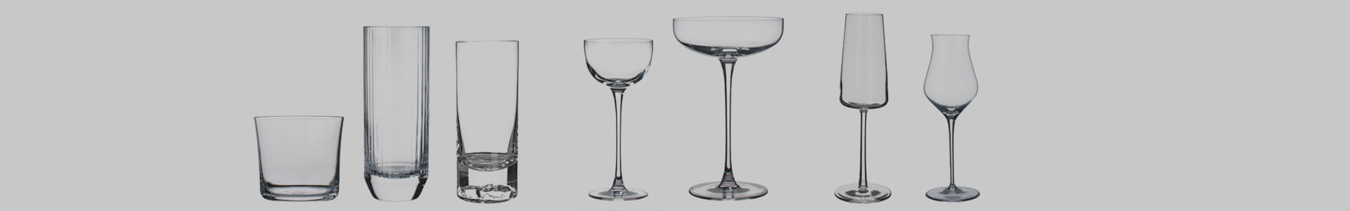 Various glasses from the manufacturer Nude Glass stand next to each other.