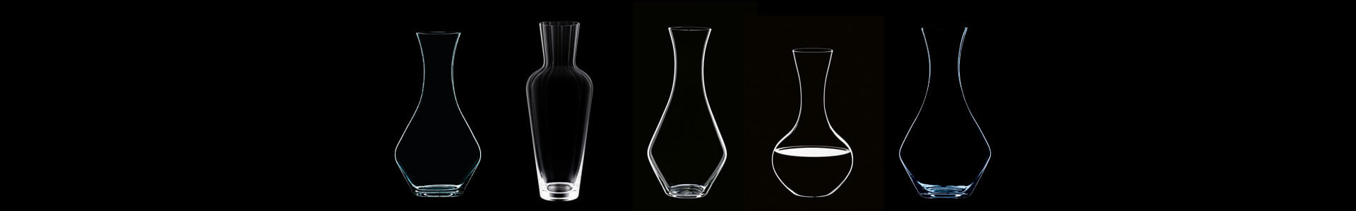 Riedel decanters of various shapes are depicted as silhouettes against a black background.